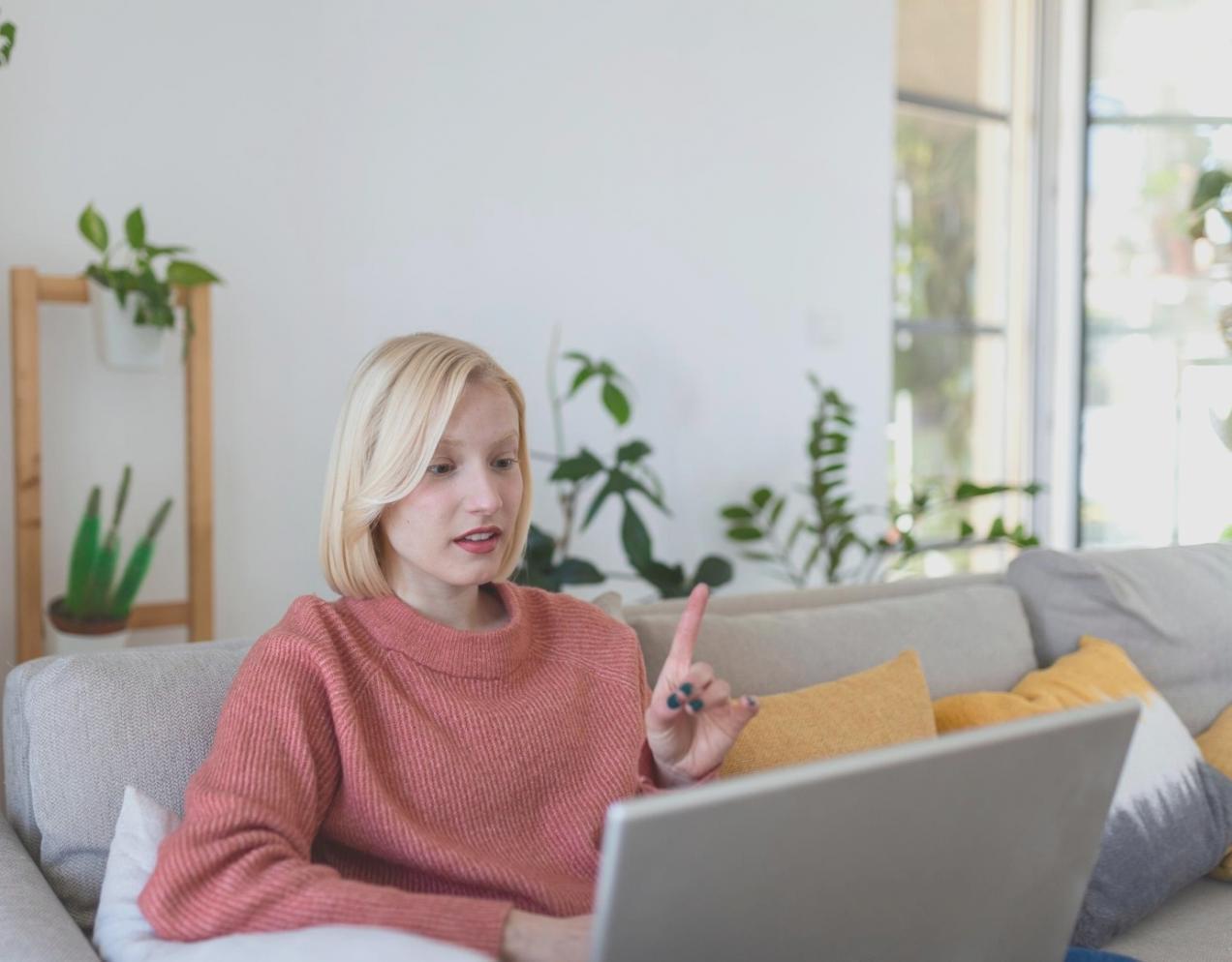 Investor reviewing financial documents and charts with laptop